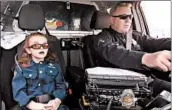  ?? DENVER POLICE DEPARTMENT 2017 ?? Olivia Gant rides with Cpt. Tim Scudder in April 2017 in Denver. Olivia, 7, died later that year in hospice care.