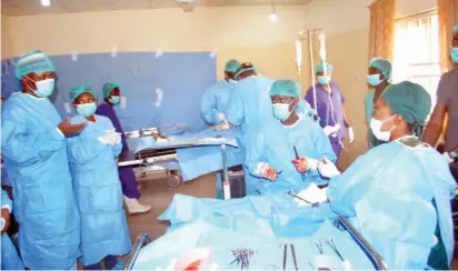  ?? NAN ?? From left: Deputy Governor of Bauchi State, Alhaji Audu Katagum (left) watches as some doctors perform surgical operations during the Presidenti­al Initiative Committee one- week Medical Outreach at Ningi General Hospital in Bauchi State yesterday