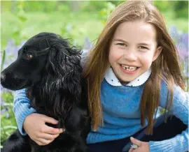  ?? ?? In his sights: At seven, William had the same happy smile as his daughter now shows with her beloved pet