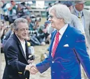  ?? Frank Franklin II Associated Press ?? BOB BAFFERT is congratula­ted after becoming only the second trainer to win two Triple Crowns.