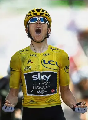  ?? — AP ?? Yes, I did it!: Britain’s Geraint Thomas, wearing the overall leader’s yellow jersey, celebrates as he crosses the finish line to win the Stage 12 of the Tour de France on Thursday.