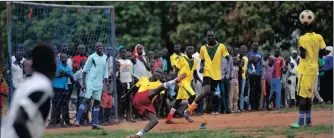 ??  ?? A South Sudanese refugee soccer player kicks the ball during a match in the Bidi Bidi refugee settlement in northern Uganda.