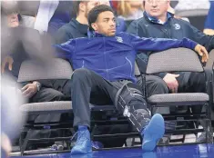  ?? NATI HARNIK/ASSOCIATED PRESS ?? Creighton’s Maurice Watson Jr., out for the season with a torn ACL, sits on the bench during Saturday’s loss to Marquette.