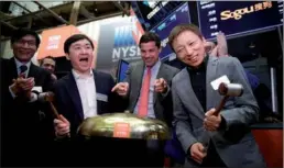  ?? XINHUA/WANG YING ?? CEO of sohu.com Zhang Chaoyang (right) and CEO of Sogou Inc. Wang Xiaochuan (second from left, front) attend the opening bell ceremony at the New York Stock Exchange in New York on Thursday. Sogou Inc., a Chinese search engine company backed by Tencent...