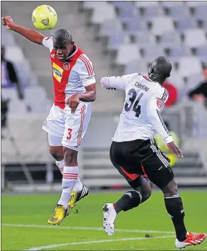  ?? PHOTO: ASHLEY VLOTMAN/GALLO IMAGES ?? REAL WARRIOR: Ajax Cape Town right-back Thulani Hlatshwayo clears the ball from an opposition player