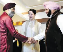  ?? SEAN KILPATRICK / THE CANADIAN PRESS ?? Defence Minister Harjit Sajjan, left, and Prime Minister Justin Trudeau meet Wednesday with Punjab Chief Minister Amarinder Singh in Amritsar, India.