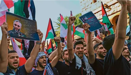  ?? ANWAR AMRO/AFP VIA GETTY IMAGES ?? Students from the American University of Beirut rallied in support of Palestinia­ns in the Lebanese capital on Monday.