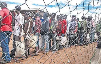  ?? Photo: Kristy Siegfried/IRIN ?? Hunger trap: Refugees at the Dzaleka camp are being rationed and food stocks will run out unless someone comes to their aid.