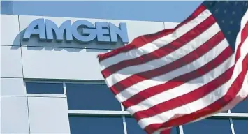  ?? — Reuters ?? An Amgen sign is seen at the company’s office in South San Francisco .