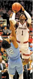  ?? Scott Strazzante / The Chronicle ?? Stanford’s Daejon Davis commits an offensive foul while shooting against North Carolina's Joel Berry II.