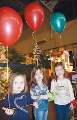  ?? NEWS PHOTO PEGGY REVELL ?? Briley French, Tenley French and Charlie Humphrey hold on to balloons they received at the Medicine Hat Lodge’s third annual Christmas Lobby Party.