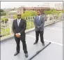  ?? Jordan Grice / Hearst Connecticu­t Media ?? Darren Mondezie, left, and Johnathan Neverson, founders of Liberty Parking LLC, with a Parker Marker in downtown Bridgeport.