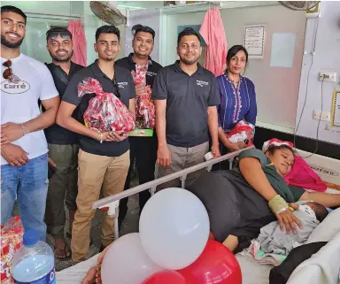  ?? ?? Feed My People team visits and presented mothers and children admitted at the Labasa Hospital with Christmas gift hampers.