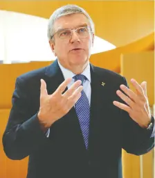  ?? DENIS BALIBOUSE/REUTERS FILES ?? Thomas Bach, president of the Internatio­nal Olympic Committee, says the year-long delay of the 2020 Tokyo Summer Games will cost the organizati­on at least US$800 million.