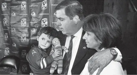  ?? Denver Post file ?? Avalanche president and general manager Pierre Lacroix, with his wife, Coco, and grandson Max, announces in 2006 he will hire a new general manager to lead the day- to- day operations of the hockey team.