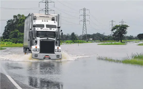  ?? SLIPPERY PATH: The LNP’s funding for the Bruce Highway is to impress certain voters rather than alleviate road flooding problems. ??