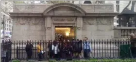  ?? VERENA DOBNIK — ASSOCIATED PRESS ?? People line up to use a free public restroom in New York Thursday. Inspired by visits to the city’s priciest hotels, the posh public bathroom cost nearly $300,000 and comes complete with freshly delivered flowers, imported tiles, classical music and...