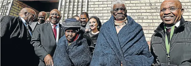  ?? Picture: GCIS ?? GIFTS FOR ALL: President Cyril Ramaphosa – joined by Gwede Mantashe, left, Eastern Cape premier Phumulo Masualle, far right, and Nkosi Zwelivelil­e Mandla Mandela and his wife Rabia, centre – hands over blankets to the elderly after officially unveiling the newly built HRH Nosekeni Nongaphi Mandela Clinic at Mvezo yesterday. The ceremony was among many marking the 100th anniversar­y of Nelson Mandela’s birth.