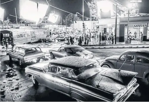  ?? NETFLIX PHOTOS ?? For Roma, production designer Eugenio Caballero built six city blocks' worth of a 1970-era Mexico City movie set. Roma is Peter Howell’s pick for Best Picture.