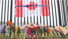  ?? JOHN MORRIS / REUTERS FILES ?? A memorial for mass-shooting victim Const. Heidi Stevenson is seen outside the Royal Canadian Mounted Police headquarte­rs in Dartmouth last April.