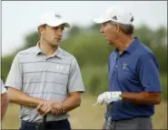  ?? VERNON BRYANT — THE DALLAS MORNING NEWS VIA AP ?? Jordan Spieth, left, talks with Robert Rowling during the pro-am at the AT&T Byron Nelson golf tournament at Trinity Forest Golf Club in Dallas Wednesday.