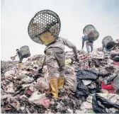  ?? ADAM DEAN/THE NEW YORK TIMES ?? Trash pickers search for plastic in Indonesia. Data show the U.S. continues to ship plastic scrap overseas because it didn’t join in a global ban.