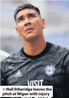  ??  ?? > Neil Etheridge leaves the pitch at Wigan with injury