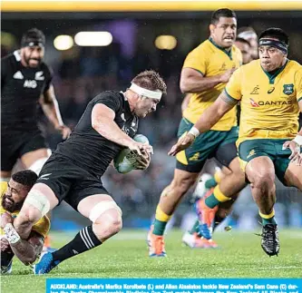  ??  ?? AUCKLAND: Australia’s Marika Koroibete (L) and Allan Alaalatoa tackle New Zealand’s Sam Cane (C) during the Rugby Championsh­ip Bledisloe Cup Test match between the New Zealand All Blacks and Australia in Auckland yesterday. —AFP