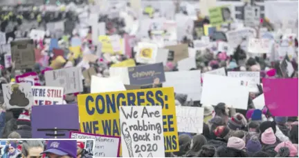  ?? (Photos: AFP) ?? WASHINGTON, DC — JANUARY 19: Demonstrat­ors hold signs during the 2019 Women’s March on January 19, 2019 in Washington, DC. Demonstrat­ions are slated to take place in cities across the country in the third annual event aimed to highlight social change and celebrate women’s rights around the world.