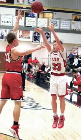  ??  ?? LFO’s Noah Harris tries to shoot over Sonoravill­e’s Brad Wilson during last week’s region tournament game in Calhoun. (Calhoun Times photo/Larry Greeson)