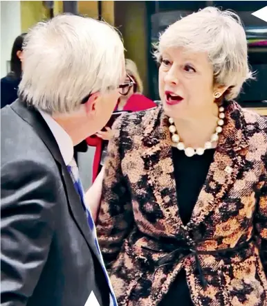  ??  ?? Theresa May angrily confronts Jean-claude Juncker over his ‘nebulous’ comment