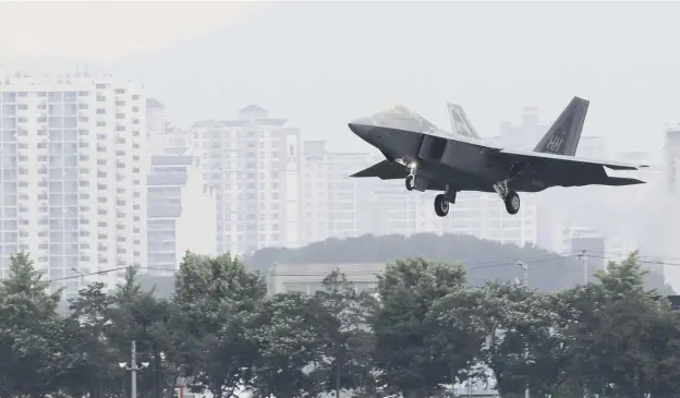  ?? PICTURE: PARK CHUL- HOG/ YONHAP VIA AP ?? 0 A US fighter jet lands at an air base in Gwangju, South Korea after taking part in the Max Thunder joint military exercise