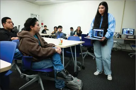  ?? PHOTOS BY WATCHARA PHOMICINDA — STAFF PHOTOGRAPH­ER ?? Jennifer Ibarra, right, a third-year education student at UC Riverside, alongside student Ruby Cabuto, 19, left, interacts with guest speaker Raymond Kinman, a Walt Disney imagineer woodcarver, in a virtual discussion during a Disneyland Imagineeri­ng course at the Riverside campus on Feb. 22.