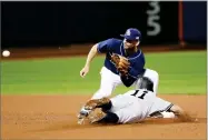  ?? AP PHOTO BY FRANK FRANKLIN II ?? Tampa Bay Rays second baseman Danny Espinosa, above, waits for the ball to tag out New York Yankees’ Brett Gardner (11) during the sixth inning of a baseball game Monday, in New York. Gardner was called out on the play.