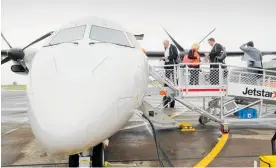  ?? Photo / Warren Buckland ?? Passengers board the first Jetstar flight from Napier to Auckland on December 1, 2015.