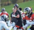  ??  ?? Falcons quarterbac­k Matt Ryan looks for a receiver during the team’s first training camp practice on Monday in Flowery Branch, Ga.