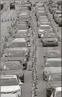  ?? Ap-wilfredo Lee ?? Cars wait in line at a drivethrou­gh COVID-19 testing site outside Hard Rock Stadium, on Wednesday in Miami Gardens, Fla. Florida is one of the nation’s hot spots for coronaviru­s. Almost 10,000 confirmed cases were added Wednesday, bringing its total since March 1 to nearly 224,000. Almost 4,000 people have died, including 48 reported by the state Wednesday.