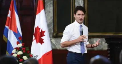  ?? SEAN KILPATRICK, THE CANADIAN PRESS ?? Prime Minister Justin Trudeau answers students’ questions at the University of Havana Wednesday. Canada’s foreign policy on Cuba won’t change, he said.