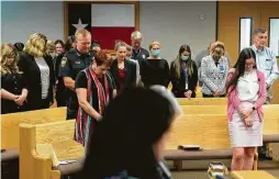  ?? Jason Fochtman / Staff photograph­er ?? Montgomery County Commission­ers Court draws a mix of people wearing masks and others without Tuesday in Conroe.