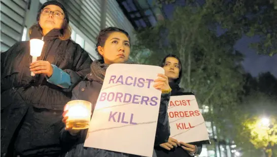  ?? Photo / AP ?? Demonstrat­ors hold a vigil for the 39 victims outside the Home Office in London, protesting at immigratio­n policies they believe contribute to human traffickin­g.