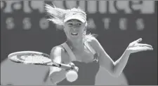  ?? AL BELLO GETTY IMAGES ?? Maria Sharapova of Russia in action against Caroline Wozniacki of Denmark at the Sony Ericsson Open Thursday in Key Biscayne, Fla.