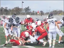  ?? ANDREW ROBINSON/MEDIANEWS GROUP ?? Upper Dublin’s defense, led by Jacob Rossman (6) and Noah Lee (1) gang up for a tackle on Saturday.