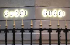  ?? — Reuters photo ?? Gucci signs are seen outside a shop in Paris, France.