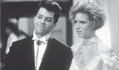  ??  ?? Duckie ( Jon Cryer) and Andie ( Molly Ringwald) were not fated to end up together in “Pretty in Pink.” The movie is re- released on Blu- ray in the “John Hughes 5- Movie Collection.”