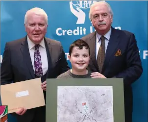  ??  ?? William Nolan, representi­ng Baltinglas­s Credit Union, with Marty Whelan and Gerry Thompson from the Irish League of Credit Unions.