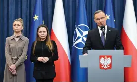  ?? Wąsik. Photograph: Radek Pietruszka/EPA ?? President Duda announcing his intention to pardon the ministers, alongside the two men’s wives – Barbara Kamínska, centre, wife of Mariusz Kaminski, and Roma Wąsik, wife of Maciej