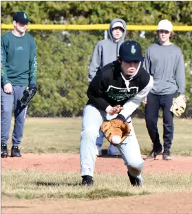  ?? PILOT PHOTO/RON HARAMIA ?? Mason Porter fields a grounder during a recent Bremen baseball practice.