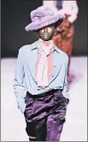  ?? GETTY ?? Tom Ford’s lilac faux-fur fedora and satin trousers.