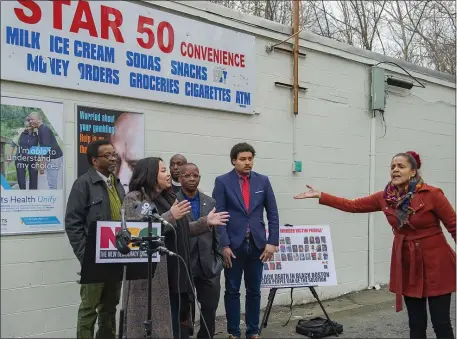  ?? AMANDA SABGA — BOSTON HERALD ?? A concerned resident raises questions during a press conference hosted by the New Democracy Coalition addressing homicide data in the parking lot of Dorchester’s Star 50 Convenienc­e on Thursday.