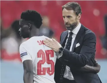  ??  ?? 0 Gareth Southgate greets Bukayo Saka as he comes off during the win over the Czech Republic